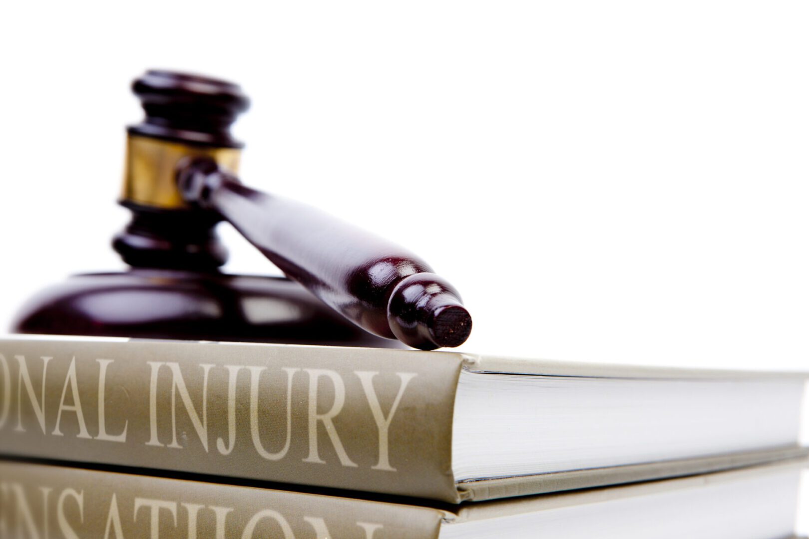 Gavel resting on personal injury book.