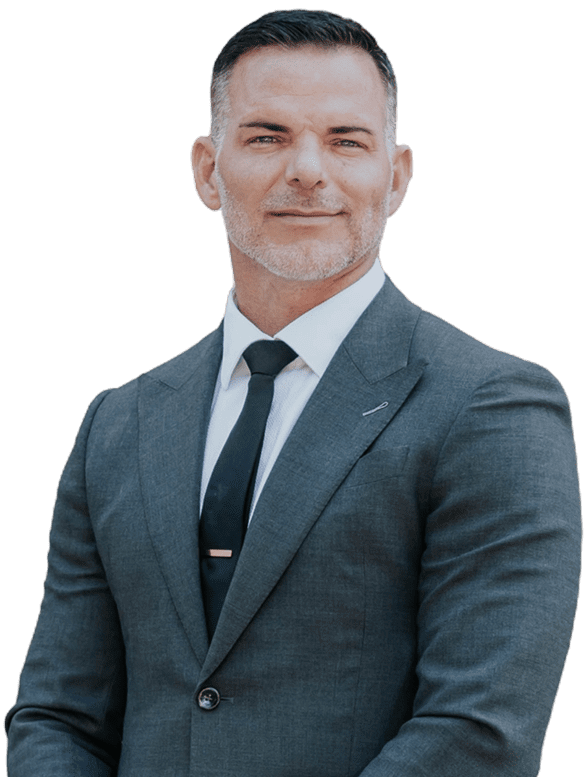 Confident businessman in a suit with a tie bar.